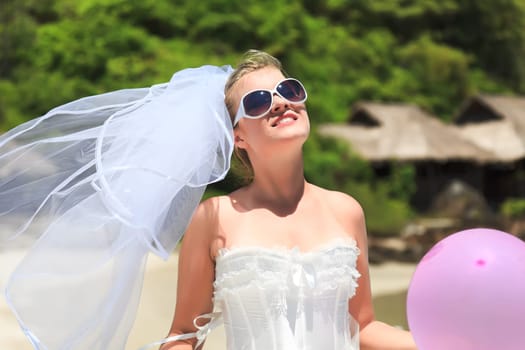 Beautiful young  bride on the tropical beach