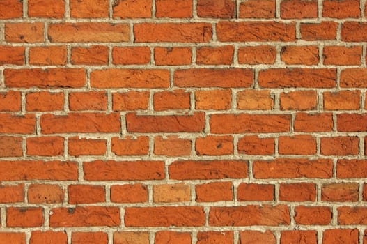 Red Bricks Wall background shot in the warm light of the sunset.