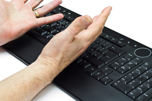 A computer user getting annoyed with his PC