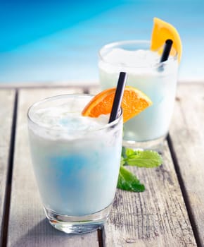 Swimming Pool Cocktail on an aged wooden deck at the south pacific near the ocean, for Tropical Food and Bevereages Concepts. Visit my Portfolio for more Drinks