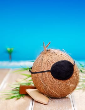 Coconut Pirate with an eye patch, for kids carnival and vacation concepts.