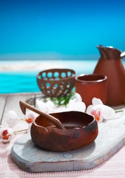 Serving refreshments in handcrafted pottery alongside the pool at a tropical resort