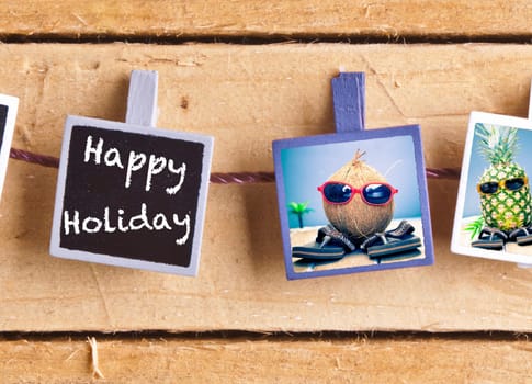 Happy Holiday snaps on a line of cool fruity friends, a coconut and pineapple, enjoying the tropics in their sunglasses and slip slops