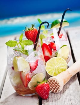Mojito with Strawberries and limes. In Front of the beach.