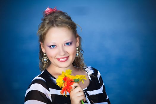 Beautiful woman with flowers in the sea