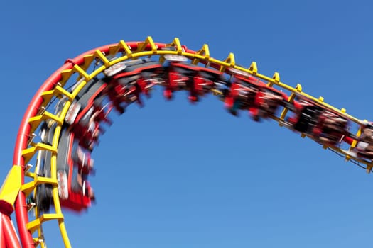 Roller coaster in front of blue background,attraction in amusement park