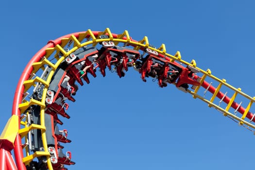 Roller coaster in front of blue background,attraction in amusement park