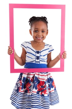 Portrait of a cute little african american girl, holding a picture frame,isolated on white background