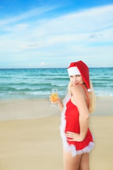 Sexy Santa&#039 s helper with glass of champagne