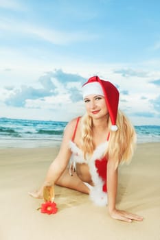 Sexy Santa&#039 s helper at the tropical beach