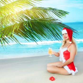 Sexy Santa&#039 s helper at the tropical beach