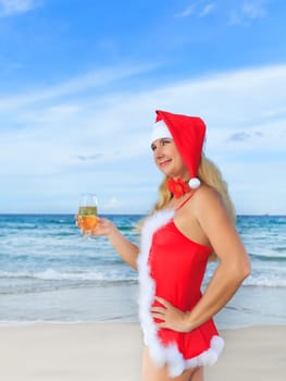 Sexy Santa&#039 s helper with glass of champagne