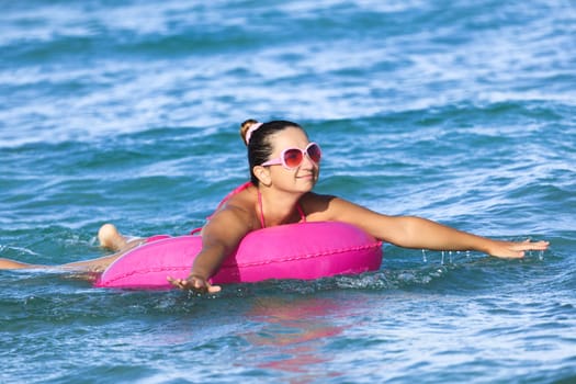 Woman has a fun time on inner tube