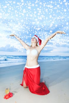 Miss Santa celebrates Christmas at the tropical beach