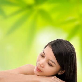 Beautiful Asian Girl having a relaxing time in beauty spa