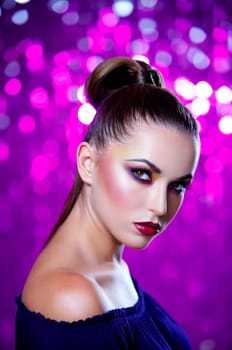 Portrait of beautiful young sexy woman on crimson background