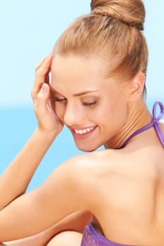 Closeup of dreaming young woman smiling outdoors