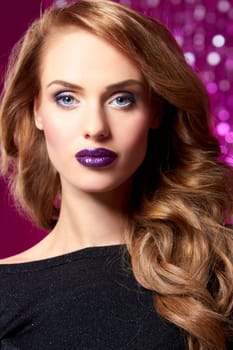 Portrait of beautiful sexy woman on purple background