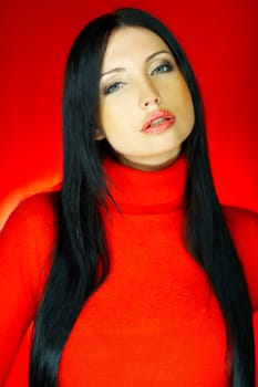 Portrait of beautiful woman wearing red sweater