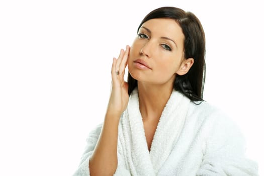 Portrait of Fresh and Beautiful brunette woman on white background wearing white bathrobe