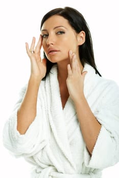 Portrait of Fresh and Beautiful brunette woman on white background wearing white bathrobe