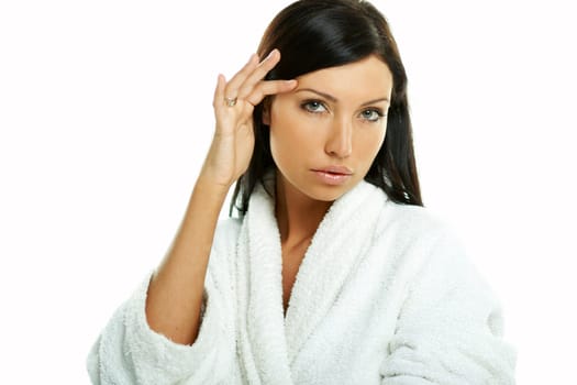 Portrait of Fresh and Beautiful brunette woman on white background wearing white bathrobe