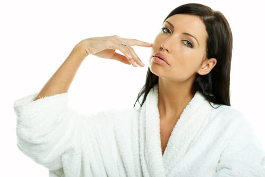 Portrait of Fresh and Beautiful brunette woman on white background wearing white bathrobe