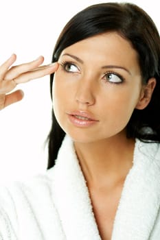 Portrait of Fresh and Beautiful brunette woman on white background wearing white bathrobe