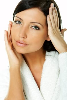 Portrait of Fresh and Beautiful brunette woman on white background wearing white bathrobe