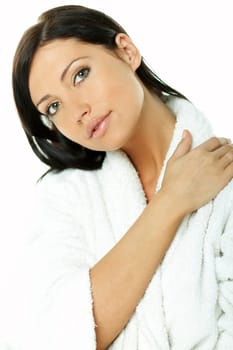 Portrait of Fresh and Beautiful brunette woman on white background wearing white bathrobe