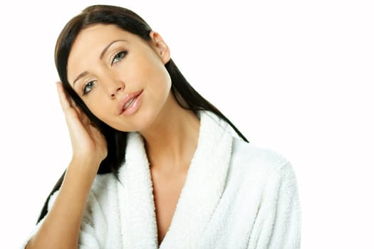Portrait of Fresh and Beautiful brunette woman on white background wearing white bathrobe