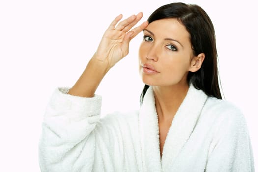 Portrait of Fresh and Beautiful brunette woman on white background wearing white bathrobe