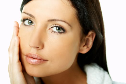 Portrait of Fresh and Beautiful brunette woman on white background wearing white bathrobe