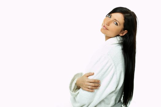 Portrait of Fresh and Beautiful brunette woman on white background wearing white bathrobe