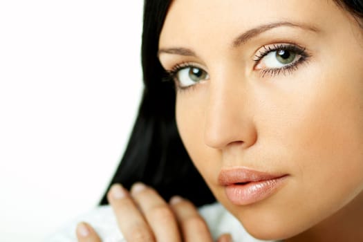 Portrait of Fresh and Beautiful brunette woman on white background wearing white bathrobe