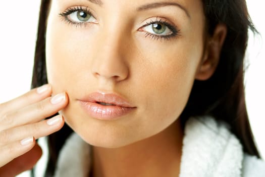 Portrait of Fresh and Beautiful brunette woman on white background wearing white bathrobe
