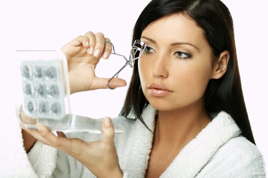 Portrait of Beautiful brunette woman doing daily morning routines (the make up series)