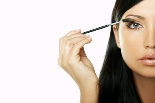 Portrait of Beautiful brunette woman doing daily morning routines (the make up series)