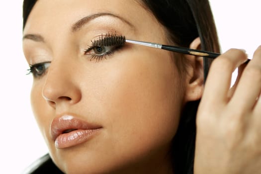 Portrait of Beautiful brunette woman doing daily morning routines (the make up series)
