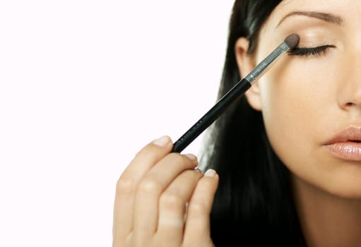 Portrait of Beautiful brunette woman doing daily morning routines (the make up series)