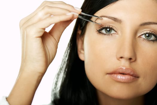 Portrait of Beautiful brunette woman doing daily morning routines (the make up series)