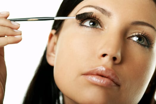 Portrait of Beautiful brunette woman doing daily morning routines (the make up series)