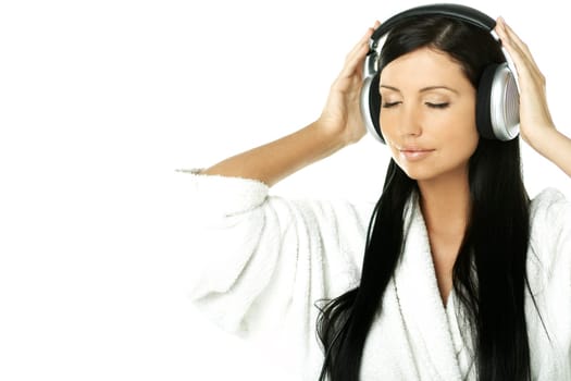 Portrait of Beautiful brunette woman listen to music with headphones