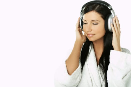 Portrait of Beautiful brunette woman listen to music with headphones