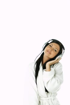 Portrait of Beautiful brunette woman listen to music with headphones