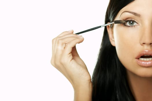 Portrait of Beautiful brunette woman doing daily morning routines (the make up series)