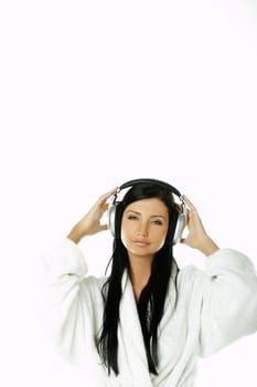 Portrait of Beautiful brunette woman listen to music with headphones