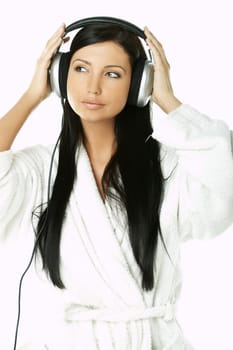 Portrait of Beautiful brunette woman listen to music with headphones