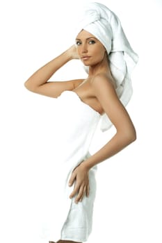 Portrait of Fresh and Beautiful brunette woman wearing white towel on her head