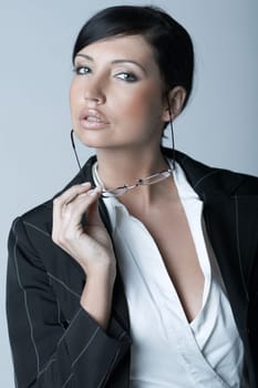 Beautiful brunette business woman with glasses isolated on clear background